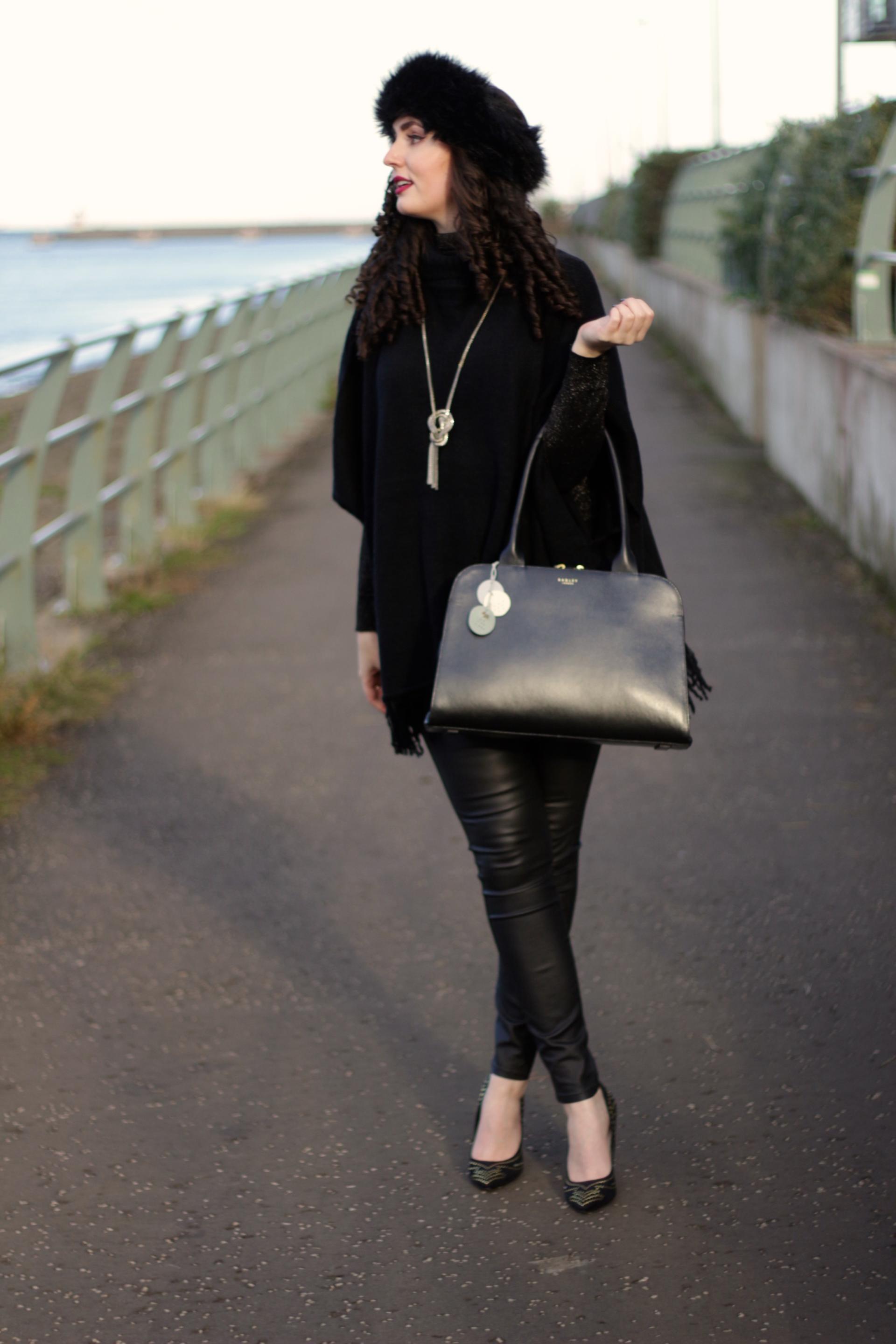 black poncho and leather jeans outfit of the day radley handbag