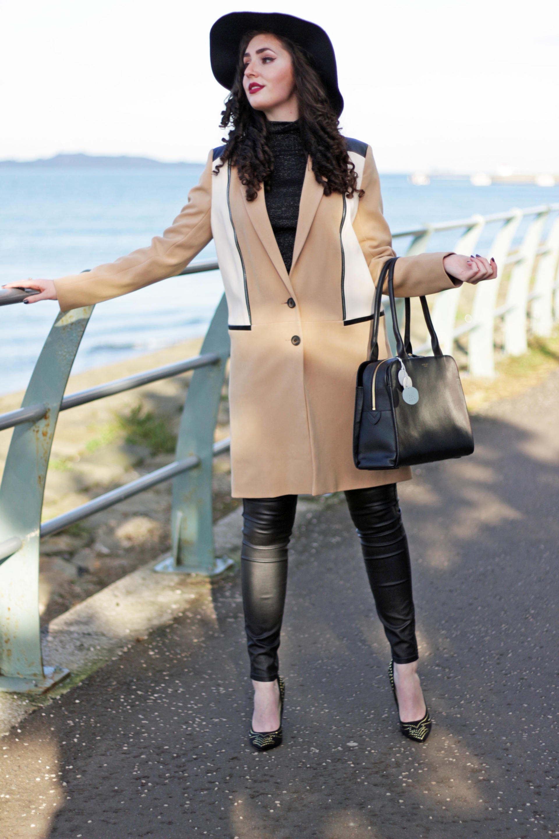 faux leather jeans and camel coat